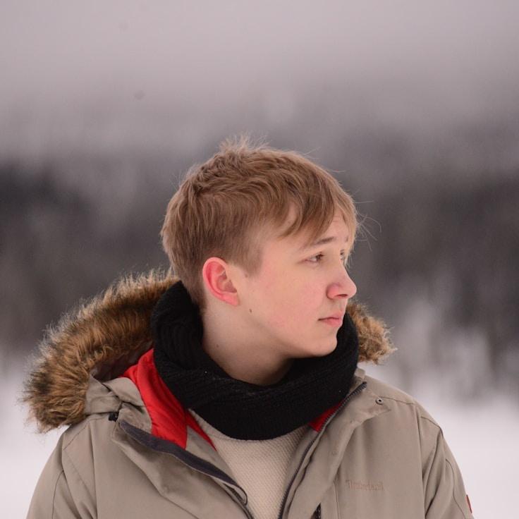 Avery Singh, Lead Design Curator at Pebble Garden Zen, reviewing corporate floral arrangements